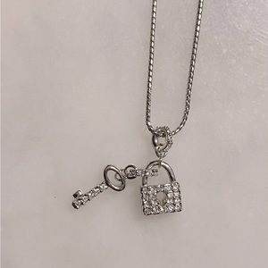 Swarovski Lock & Key necklace. Never worn. Comes with box.